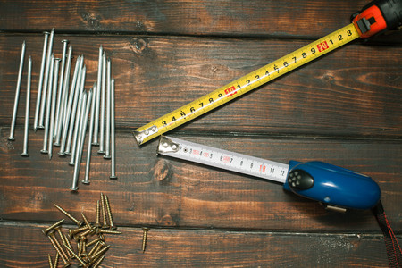 Repair modern tools on dark wooden background, top view, copy spaceの写真素材