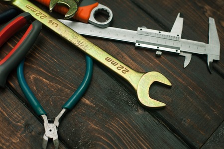 Repair modern tools on dark wooden background, top view, copy spaceの写真素材