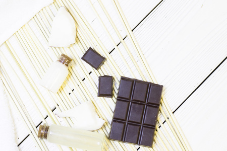 Natural herbal skin care products, top view ingredients coconut, chocalate on table concept of the best all natural face moisturizer. Facial treatment preparation backgroundの写真素材