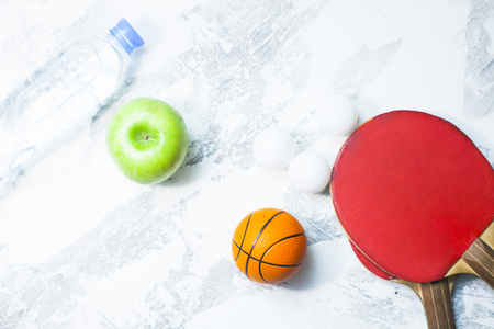 Sport fitness, weight loss concept. racket, balls on white wooden background. Vintage retro  filterの写真素材