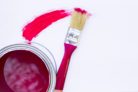 House renovation concept, colorfull paint cans and paintbrushes on wooden background top viewの写真素材