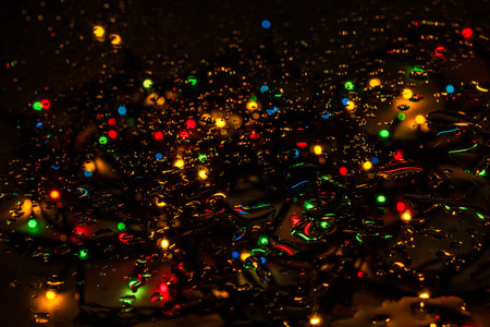 Lights and drops of water. Background.