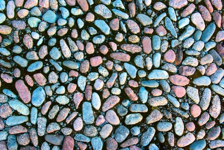 Old colour stone pebble wall の写真素材