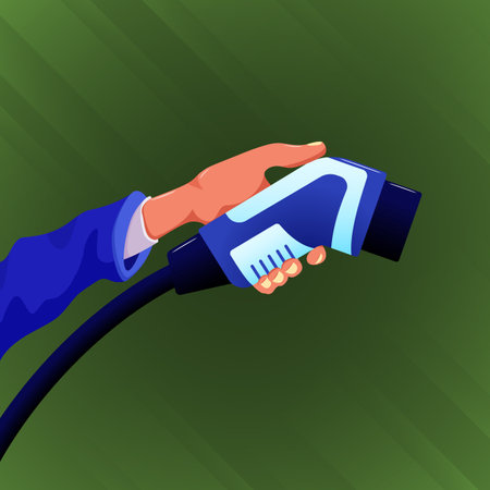 Hand holding electric car charger connector isolated on green background.のイラスト素材