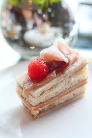 Chocolate is a set menu for afternoon tea  Include water, tea, bread, ham Macaron Pie Strawberry Cake の写真素材