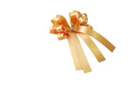 Golden ribbon and bow on a gift box in festivals such as Christmas and New Year.の写真素材