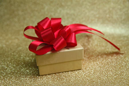 Red ribbon and bow On White gift box is mounted in festivals such as Christmas and New Year.の写真素材