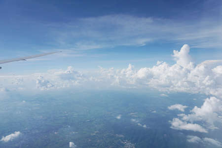 Airplane wing on a background of cloudsの写真素材