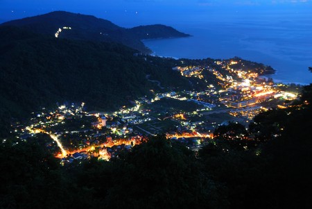 High angle of Phuket Town in the valley at nightの写真素材