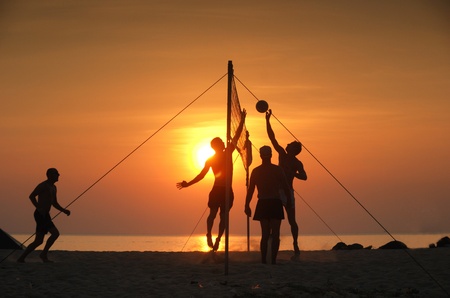 Beach volleyball. Is a popular sport that is played on the beach and playground sandの写真素材