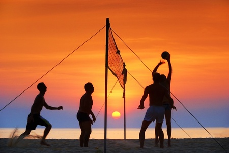  silhouette play  beach  volleyball. Sunset timeの写真素材