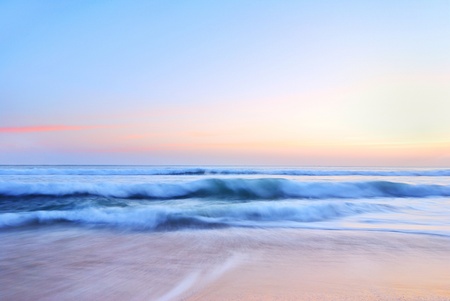  sea wave on the beach at sunset timeの写真素材