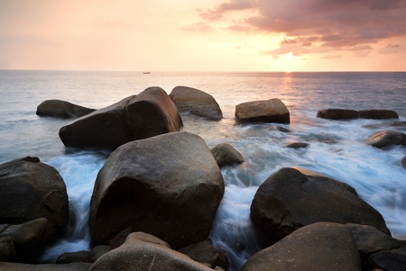  sea wave on the beach at sunset timeの写真素材
