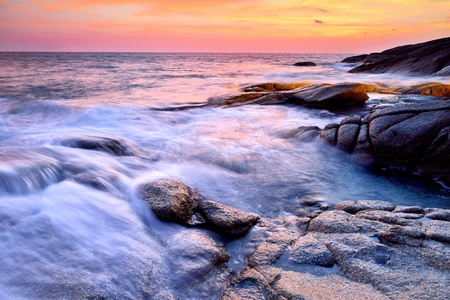  sea wave on the beach at sunset timeの写真素材