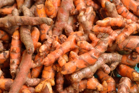 Turmeric root in Vegetable market for cookingの写真素材