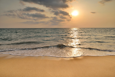 Tropical sand beach with sunsetの写真素材