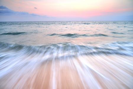 Tropical sand beach with sunsetの写真素材