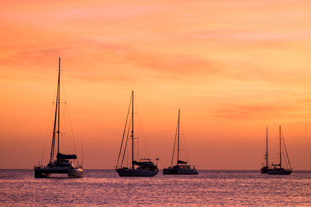 silhouette of sail boat on sea at sunset ,phuket,thailand