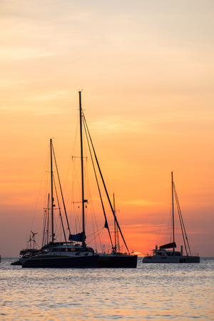 silhouette of sail boat on sea at sunset ,phuket,thailandの写真素材