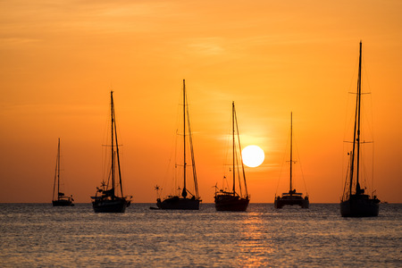 silhouette of sail boat on sea at sunset ,phuket,thailandの写真素材