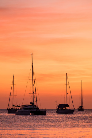 silhouette of sail boat on sea at sunset ,phuket,thailandの写真素材