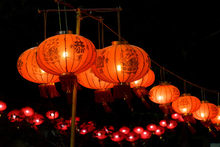 Chinese lanterns at night , Chinese New Year decorations (text means good luck)の写真素材