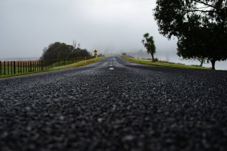 The Wide Long Foggy Roadの写真素材
