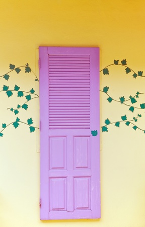 Violet door with decorationの写真素材