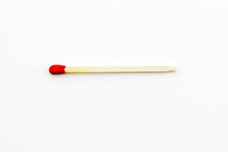 Close-up of a red match isolated on a white backgroundの写真素材