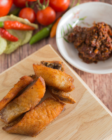 Snake head fish fried with fermented fish spicy dipの写真素材