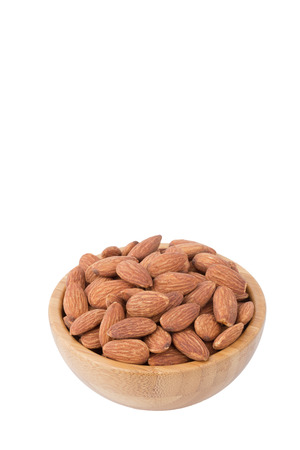 Almonds in the bowl with white backgroundの写真素材