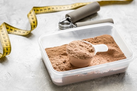 Sport and diet nutrition with equipment on stone background top viewの写真素材