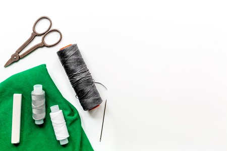 tailor workspace with sewing and handmade tools white desk background top view mock up