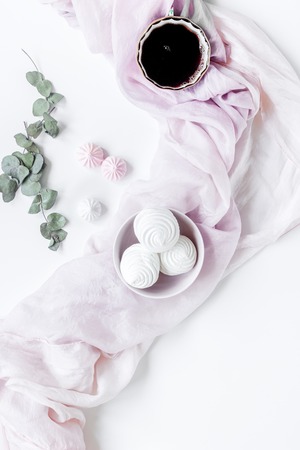 Woman lunch with marsh-mallow and flowers trendy design in soft light on white table background flat layの写真素材
