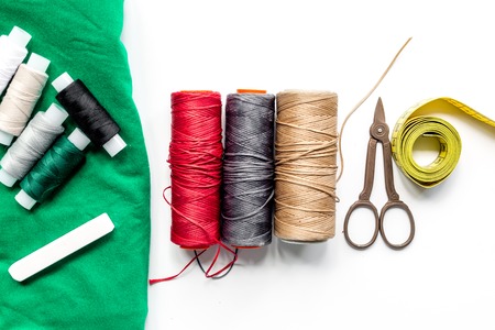 Sewing tools, fabric and kit for handmade hobby collection on white background top viewの写真素材