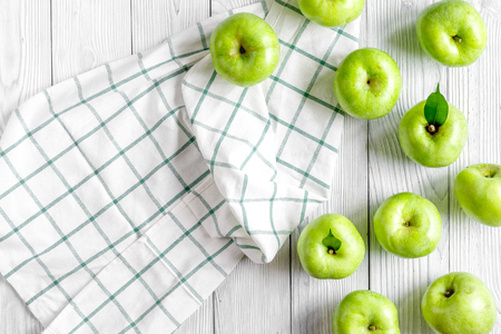fitness food with fresh green apples and napkin on white background top viewの写真素材