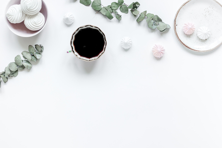 woman desk with plant, coffee and marsh-mallow in spring desing on white background flat lay mock-upの写真素材
