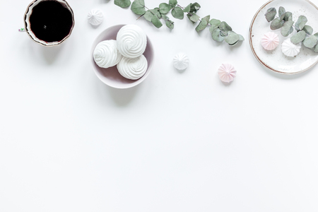 sweet marsh-mallow and flowers on woman white desk background top view mock upの写真素材