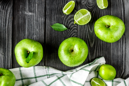 summer food with green apples on dark table background top viewの写真素材