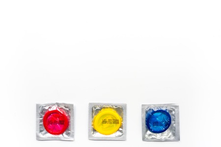 condoms for male contraception and birth control on white background top view mockupの写真素材