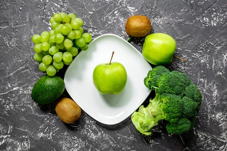 organic food for homemade salad with green vegetables on dark desk background top viewの写真素材