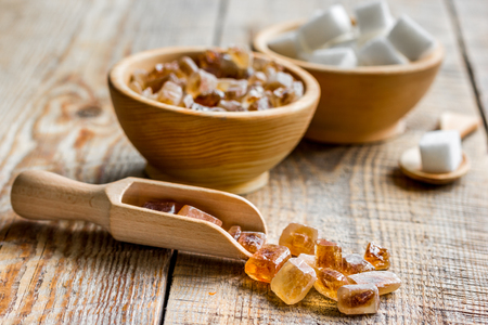 variety lumps of sugar in bowls on wooden table backgroundの写真素材
