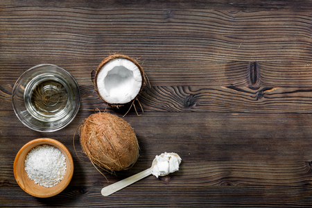 broken coconut for food on wooden table background top view space for textの写真素材