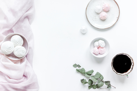 woman light breakfast with marsh-mallow and coffee on white table background top view space for textの写真素材