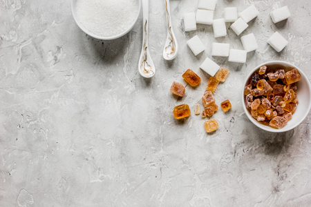 variety of sugar in bowls on gray kitchen table background top view space for textの写真素材