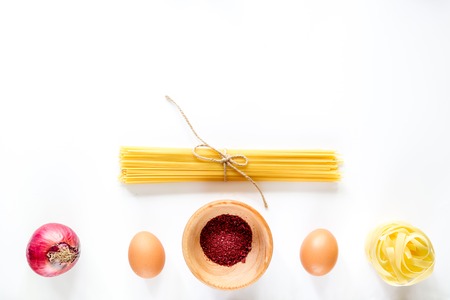 Preparing for cooking italian pasta white background top view copyspaceの写真素材