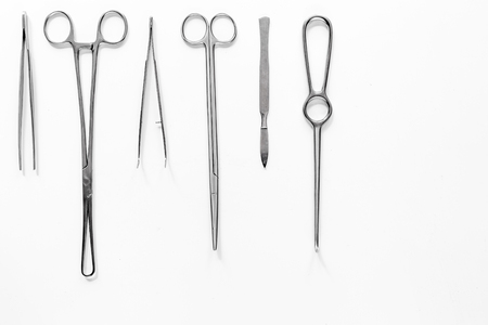 Medical instruments for plastic surgery on white backgrond top view copyspaceの写真素材