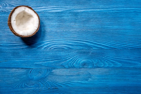 fresh coconut on blue wooden desk background top view mock upの写真素材