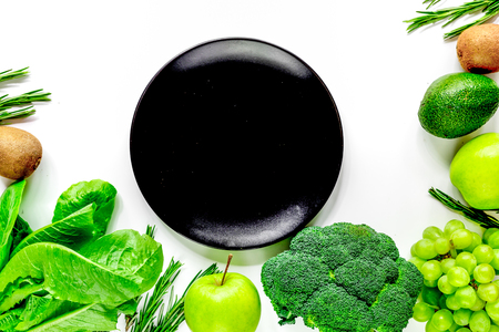 green fresh food for fitness diet on white kitchen table background top view space for textの写真素材