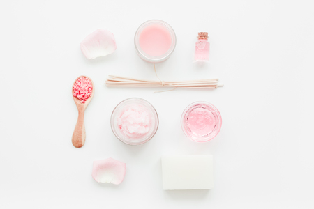 body treatment with rose extract and cosmetic set white desk background top viewの写真素材